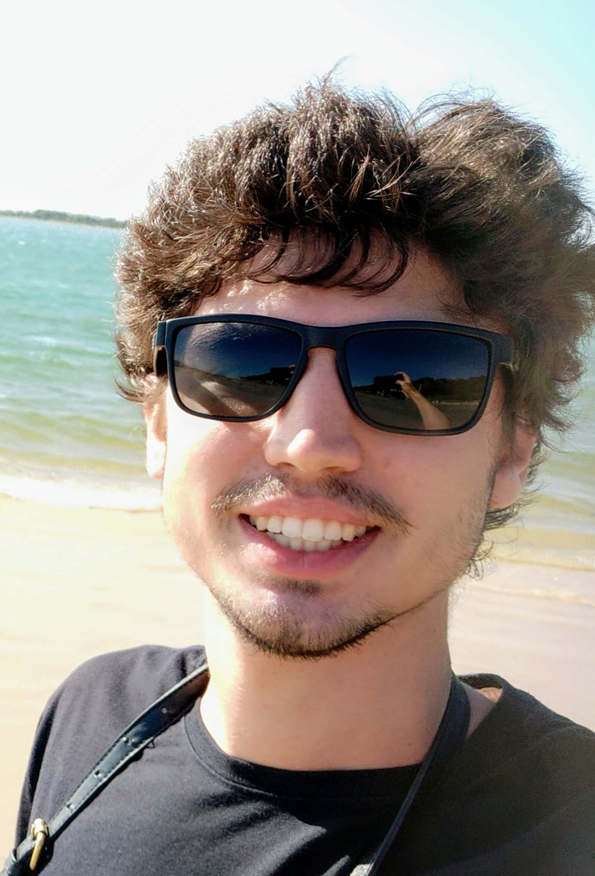 Eduardo smiling on the beach!